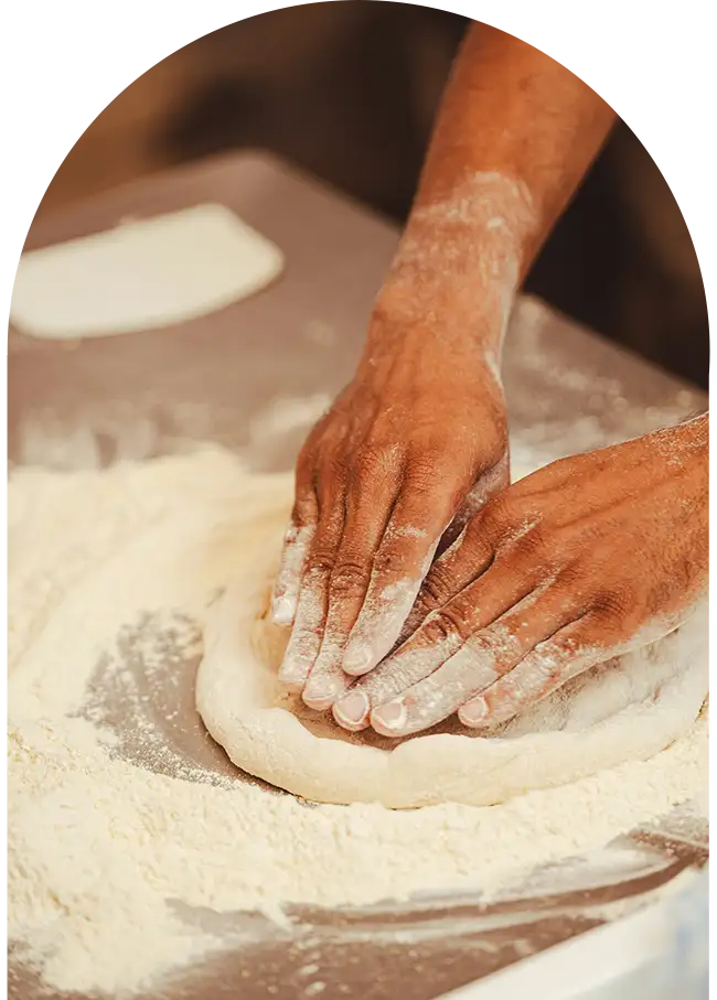 Hands kneading traditional Moroccan bread